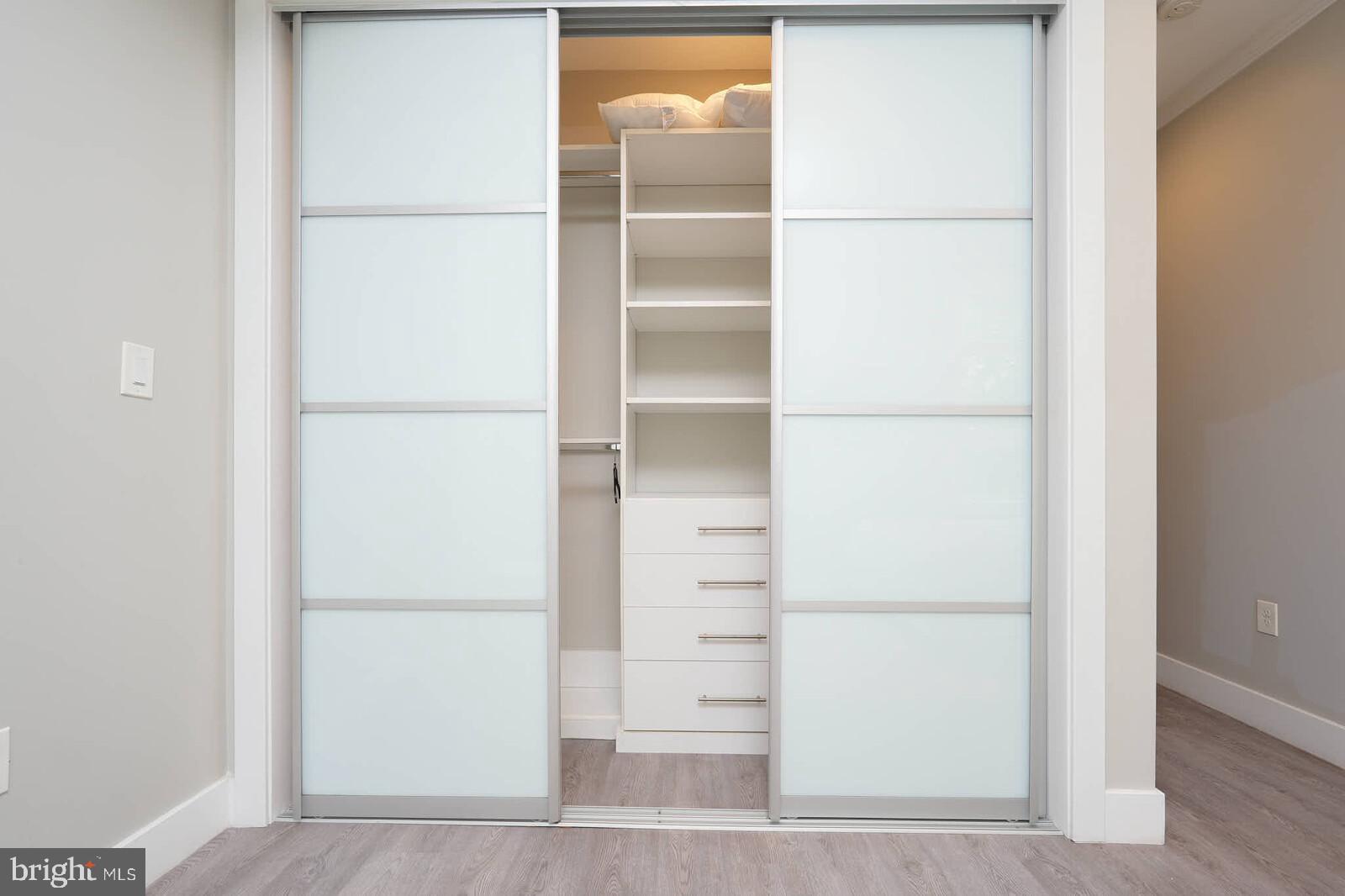 1461 Chapin Street Northwest Washington, DC 20009 - Photo 42 of 67 a view of walk in closet with empty racks