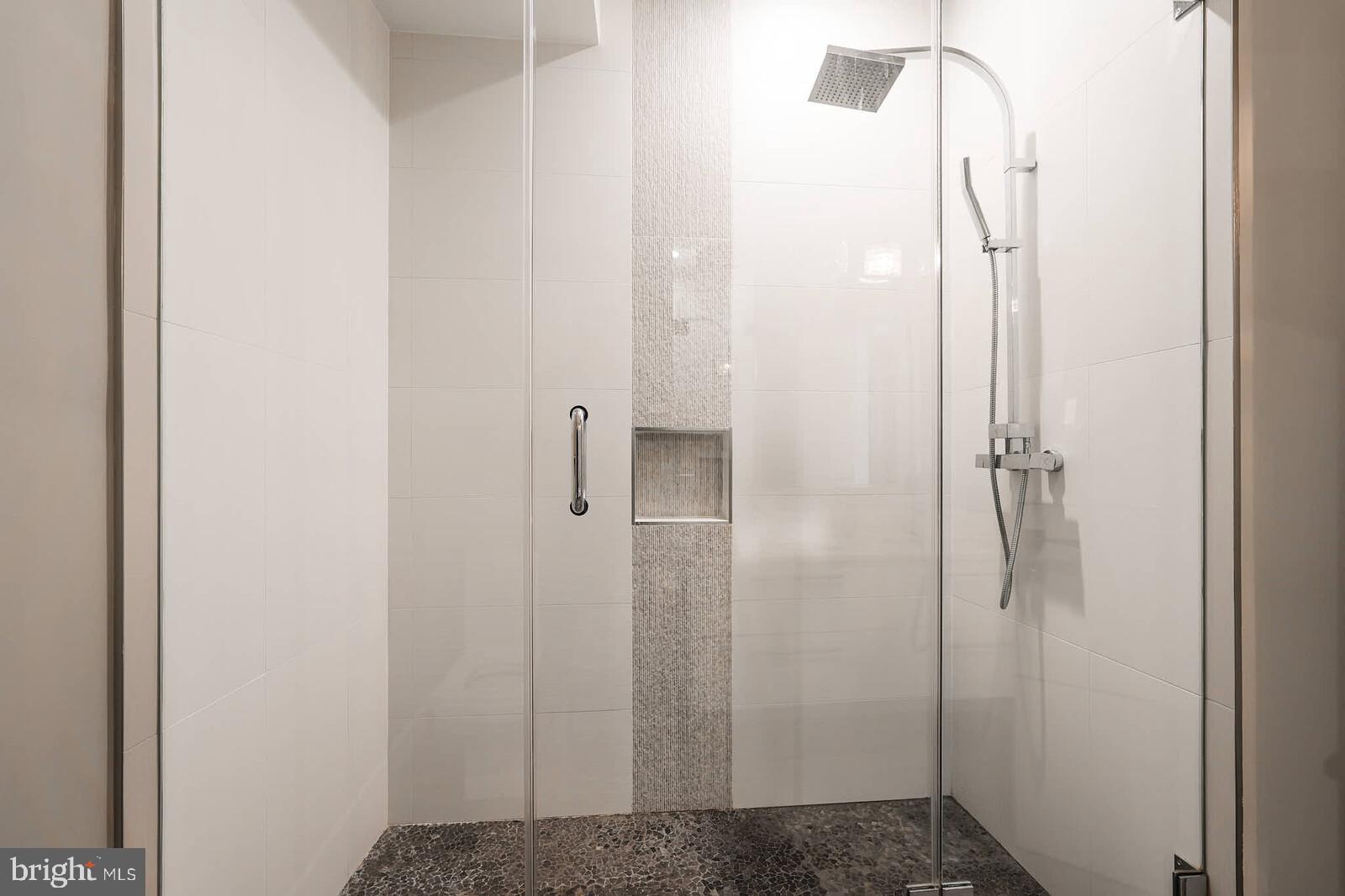 1461 Chapin Street Northwest Washington, DC 20009 - Photo 44 of 67 a bathroom with a glass shower door