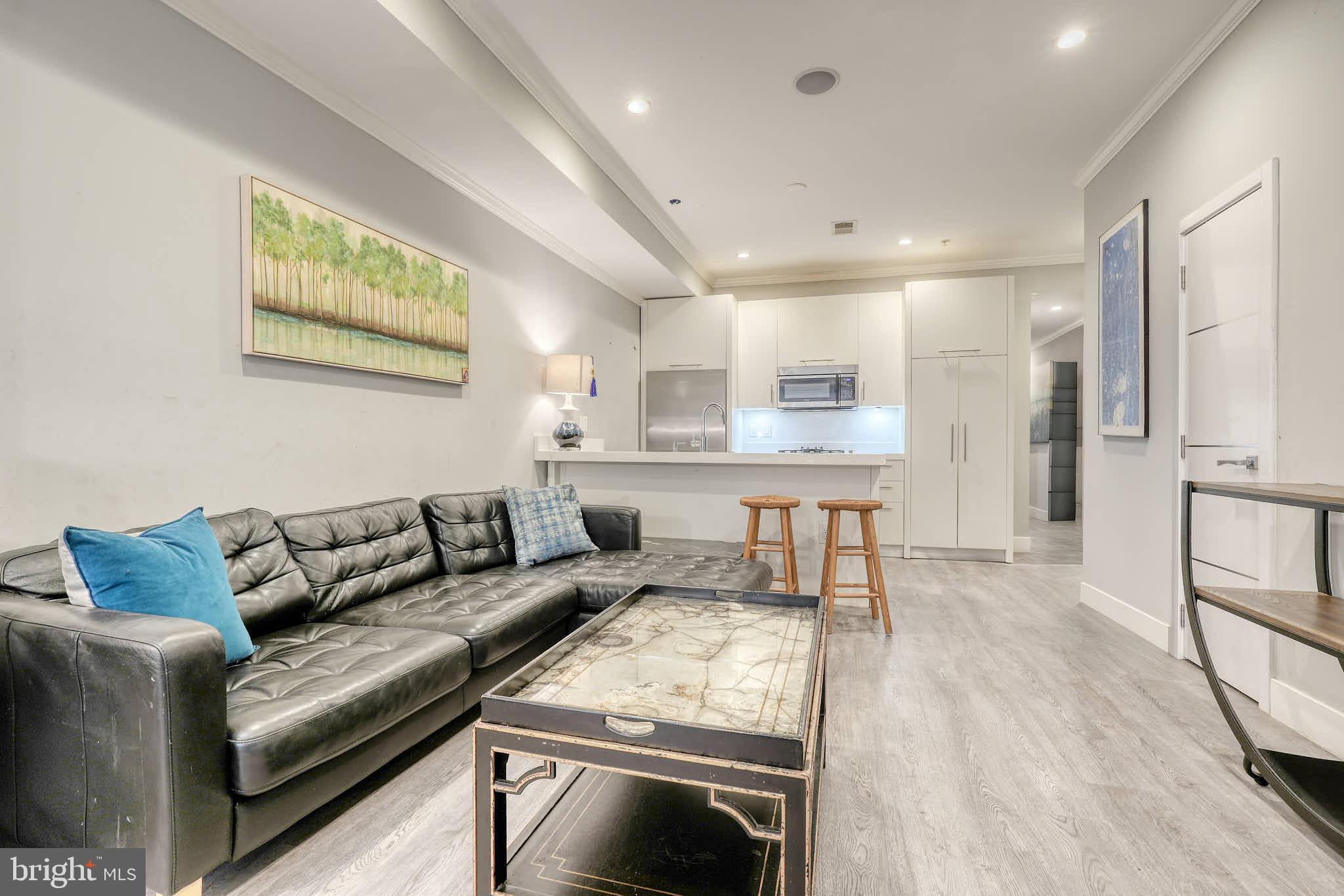 1461 Chapin Street Northwest Washington, DC 20009 - Photo 45 of 67 a living room with furniture and a wooden floor