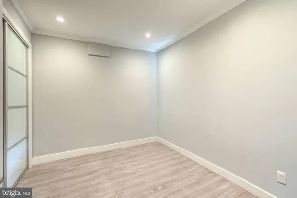a bedroom with a bed and a lamp