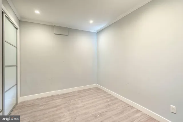 a bedroom with a bed and a lamp