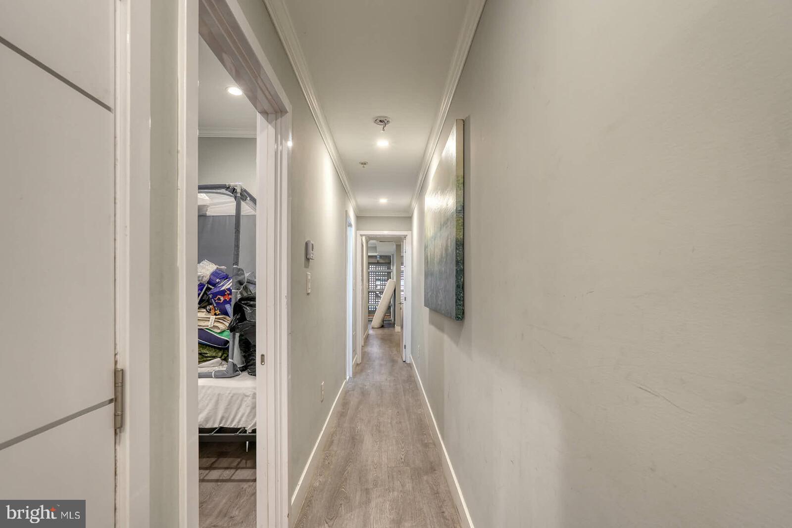 1461 Chapin Street Northwest Washington, DC 20009 - Photo 49 of 67 a view of a hallway with wooden floor and staircase