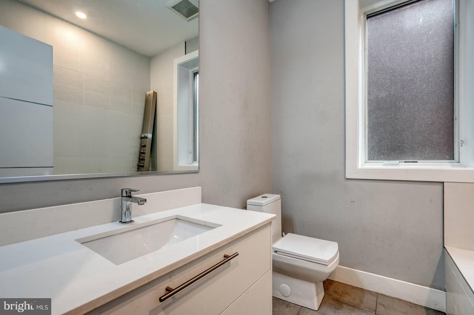 1461 Chapin Street Northwest Washington, DC 20009 - Photo 50 of 67 a bathroom with a sink and a toilet