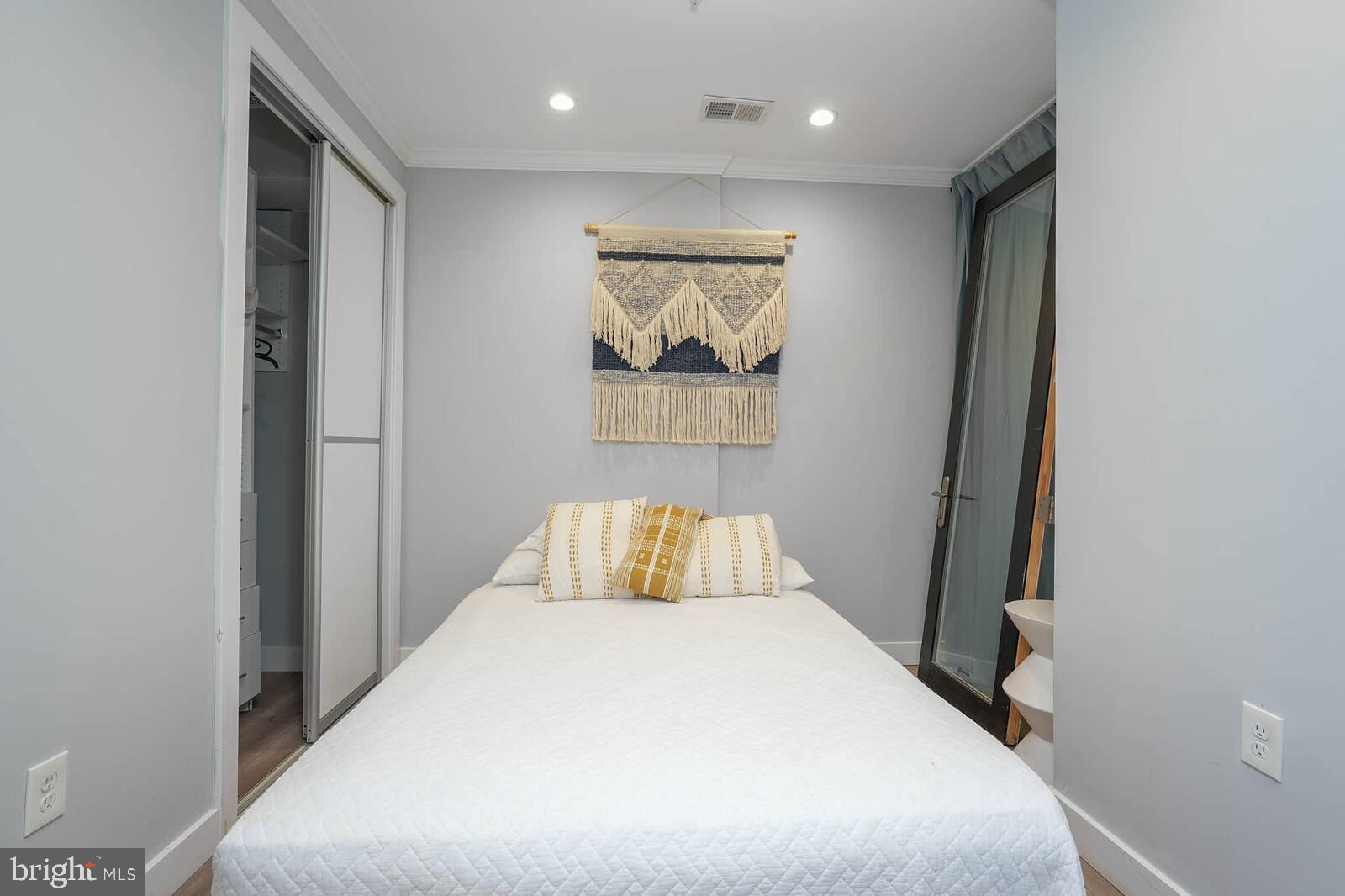 1461 Chapin Street Northwest Washington, DC 20009 - Photo 60 of 67 a bedroom with a bed and a window