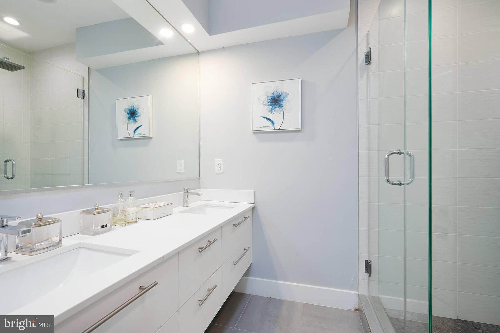 1461 Chapin Street Northwest Washington, DC 20009 - Photo 61 of 67 a bathroom with a double vanity sink and a mirror