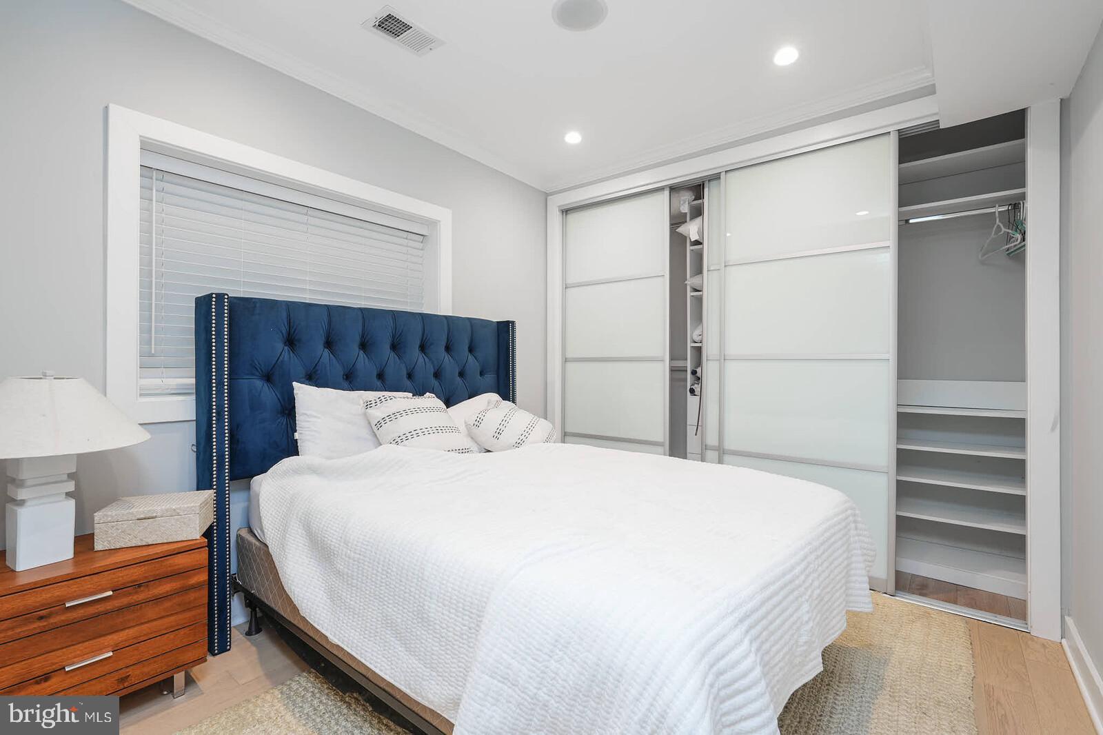 1461 Chapin Street Northwest Washington, DC 20009 - Photo 62 of 67 a bedroom with a bed and a lamp