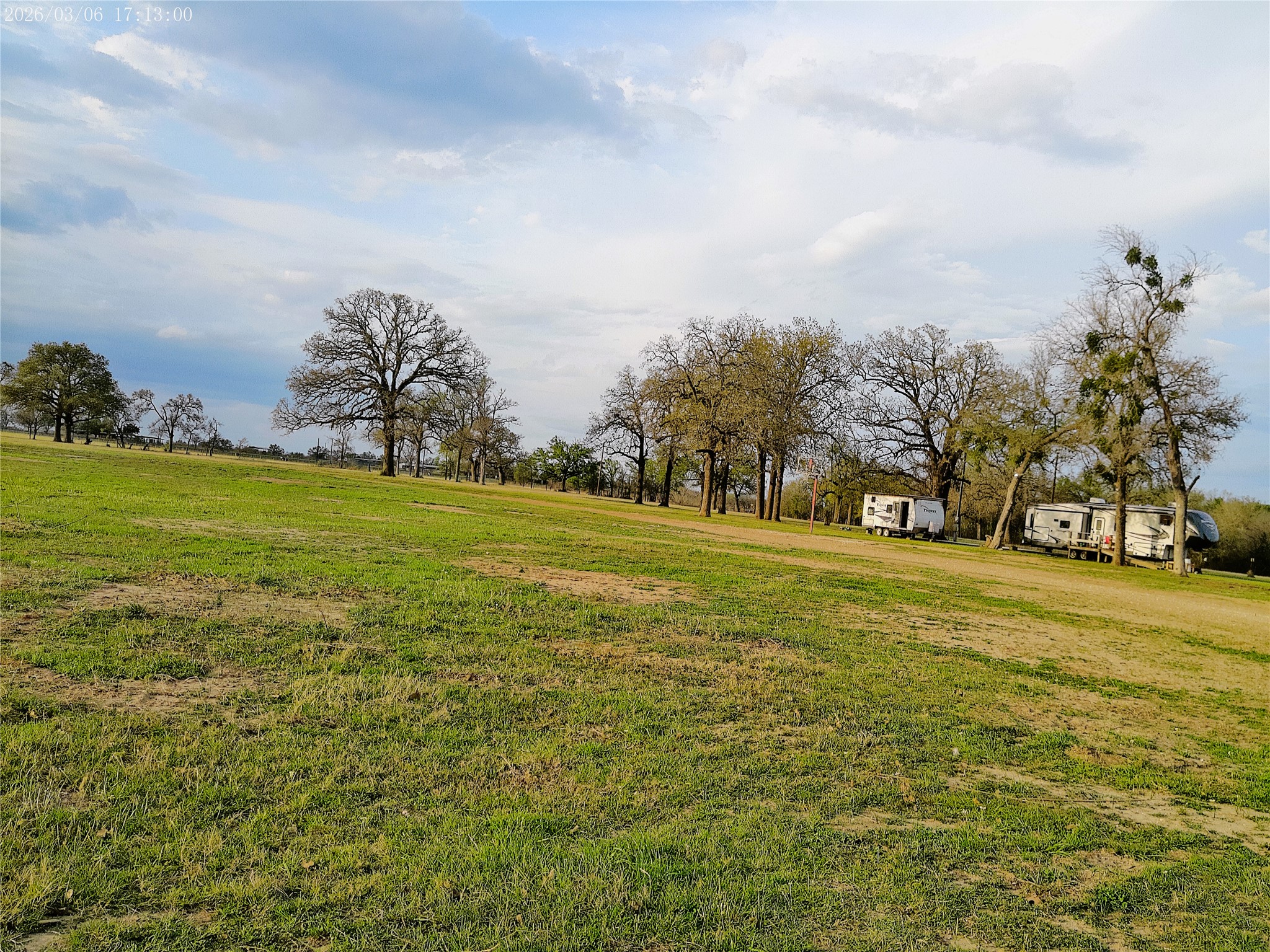 1042 Los Ranchitos Road Cameron, TX 76520 - Photo 26 of 40 a view of a field with trees in the background