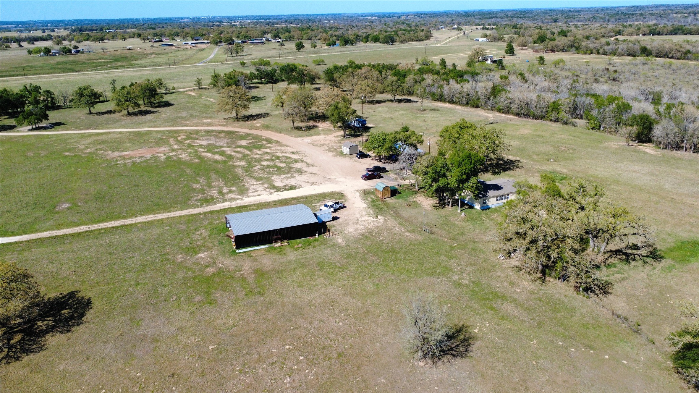 1042 Los Ranchitos Road Cameron, TX 76520 - Photo 34 of 40 an aerial view of a houses with a yard