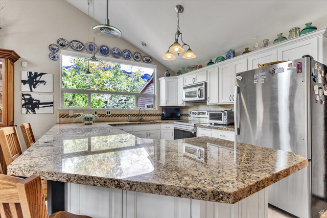 2863 Fallentine Road Sandy, UT 84093 - Photo 13 of 48 Spacious kitchen island featuring a polished stone countertop and seating