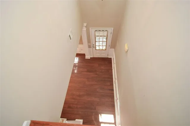 a view of a hallway with windows