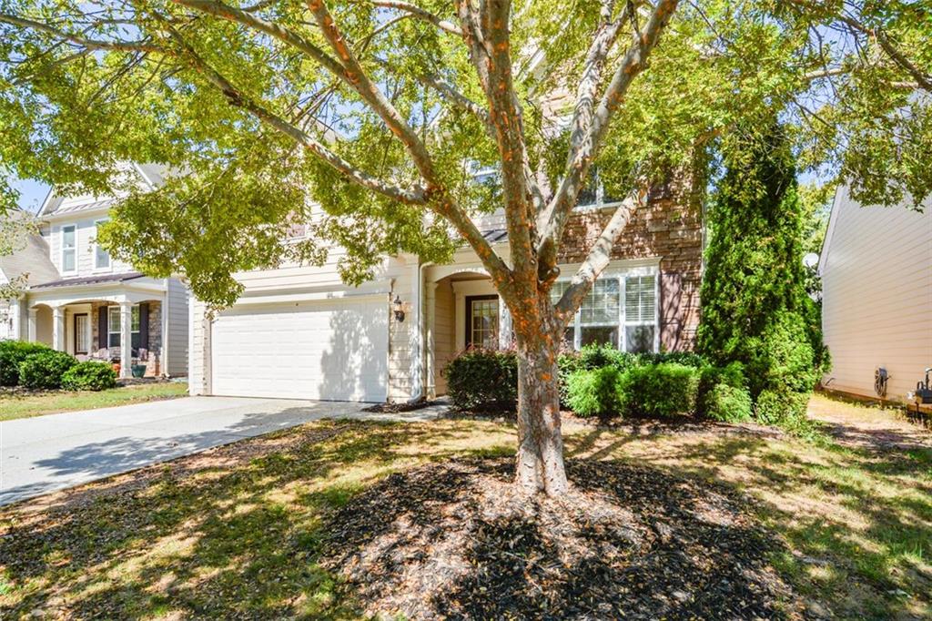710 Berkeley Terrace Canton, GA 30115 - Photo 2 of 49 a front view of a house with a yard