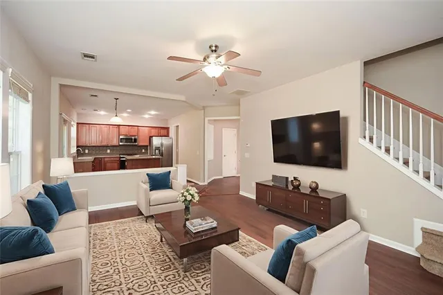 a living room with furniture and a flat screen tv