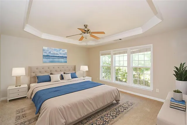 a bedroom with a large bed and a window