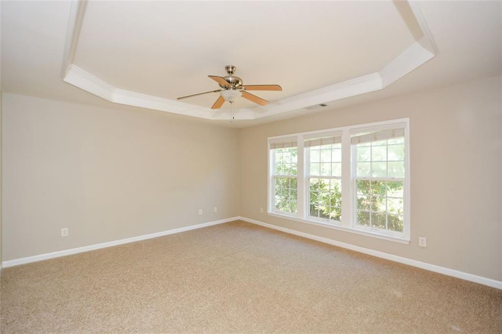 710 Berkeley Terrace Canton, GA 30115 - Photo 28 of 49 an empty room with a window and a fan