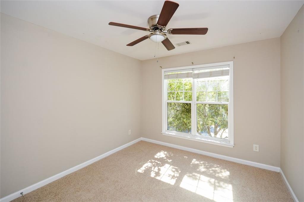 710 Berkeley Terrace Canton, GA 30115 - Photo 37 of 49 a view of a livingroom with a ceiling fan and window