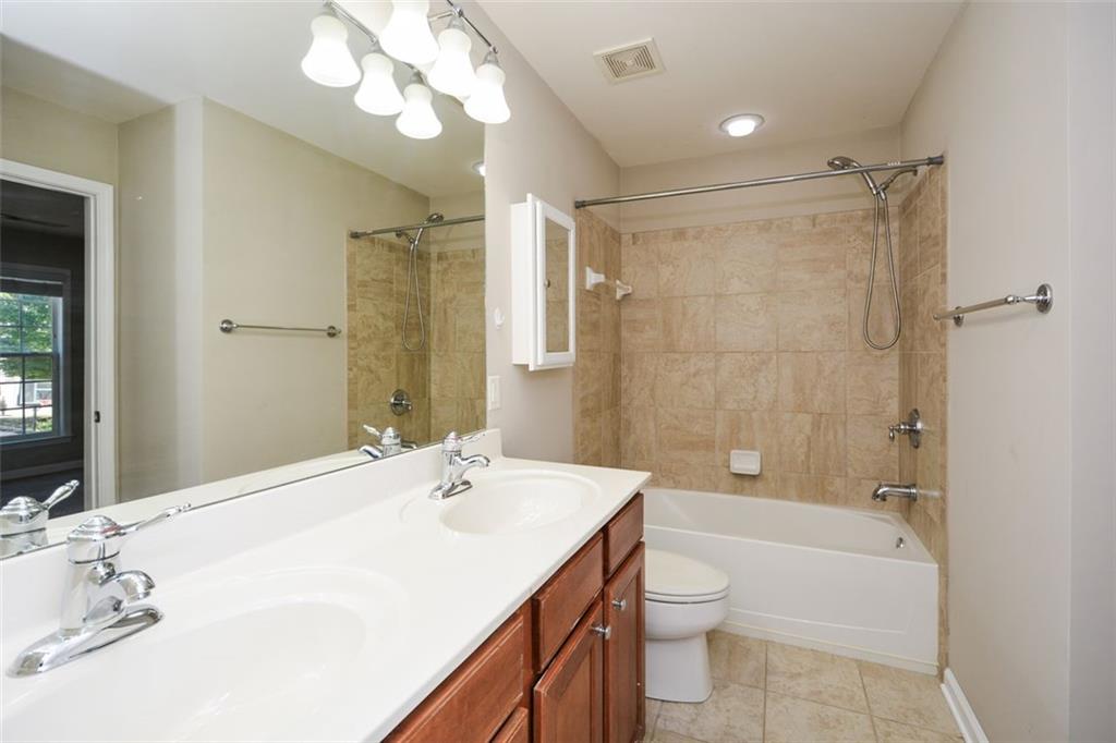 710 Berkeley Terrace Canton, GA 30115 - Photo 43 of 49 a bathroom with a sink a toilet and shower