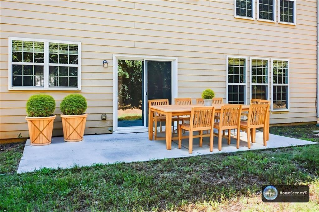 710 Berkeley Terrace Canton, GA 30115 - Photo 45 of 49 a view of a house with backyard porch and sitting area