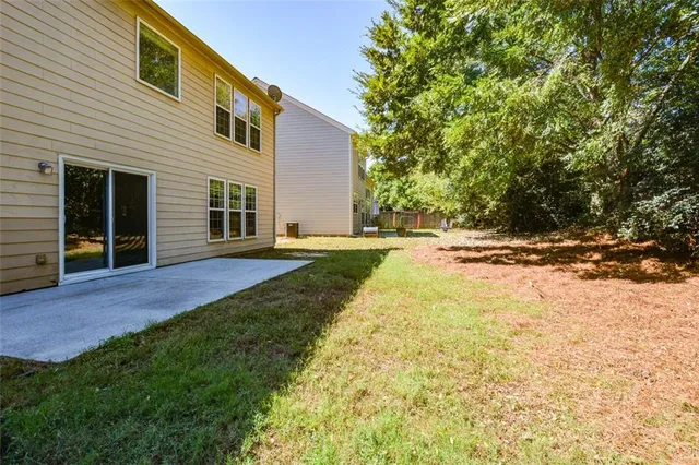 a view of a backyard with a tree