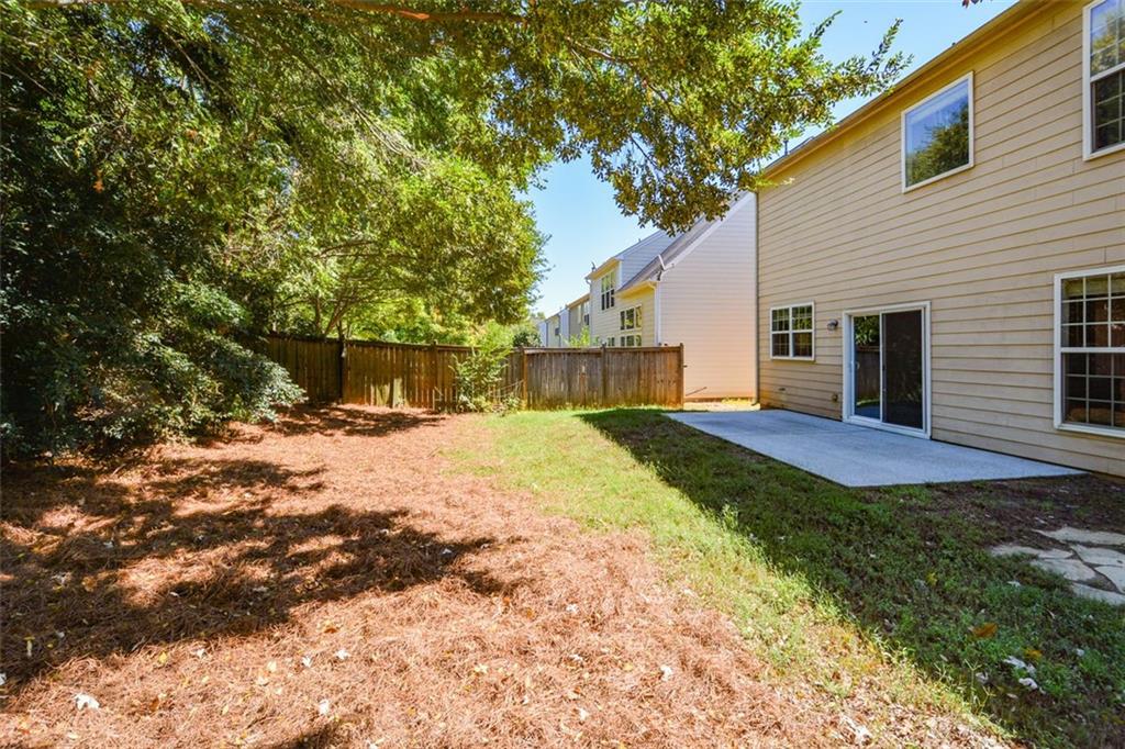 710 Berkeley Terrace Canton, GA 30115 - Photo 47 of 49 a view of a backyard with a tree