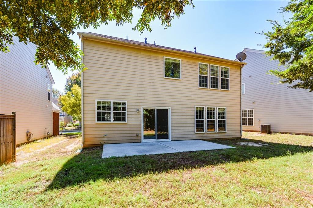 710 Berkeley Terrace Canton, GA 30115 - Photo 48 of 49 a view of a house with backyard and sitting area
