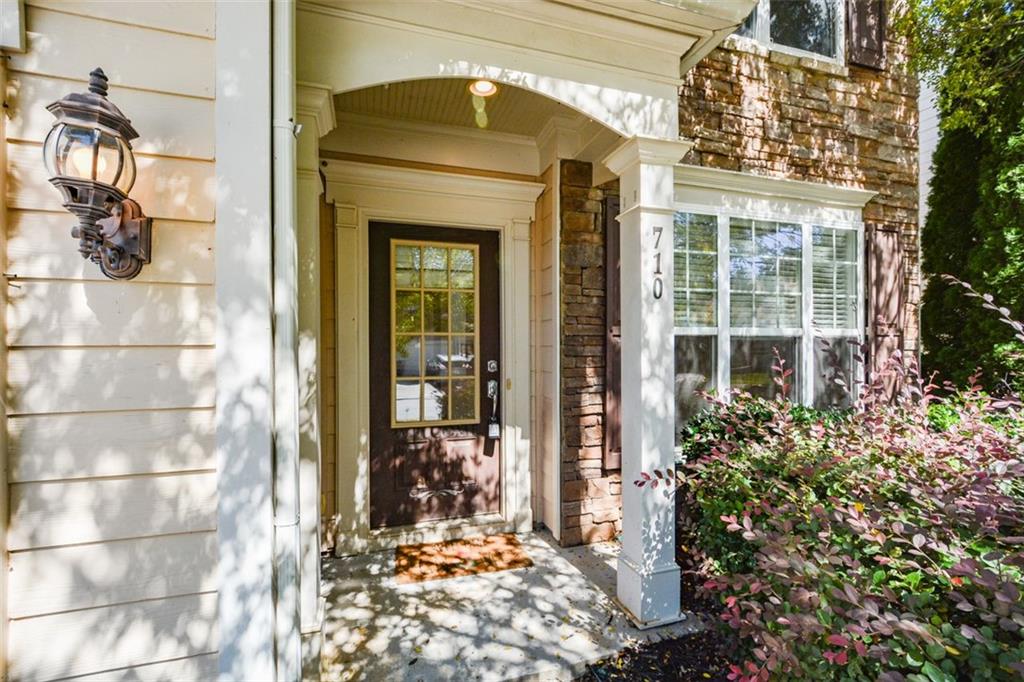 710 Berkeley Terrace Canton, GA 30115 - Photo 5 of 49 a front view of a house with a glass door