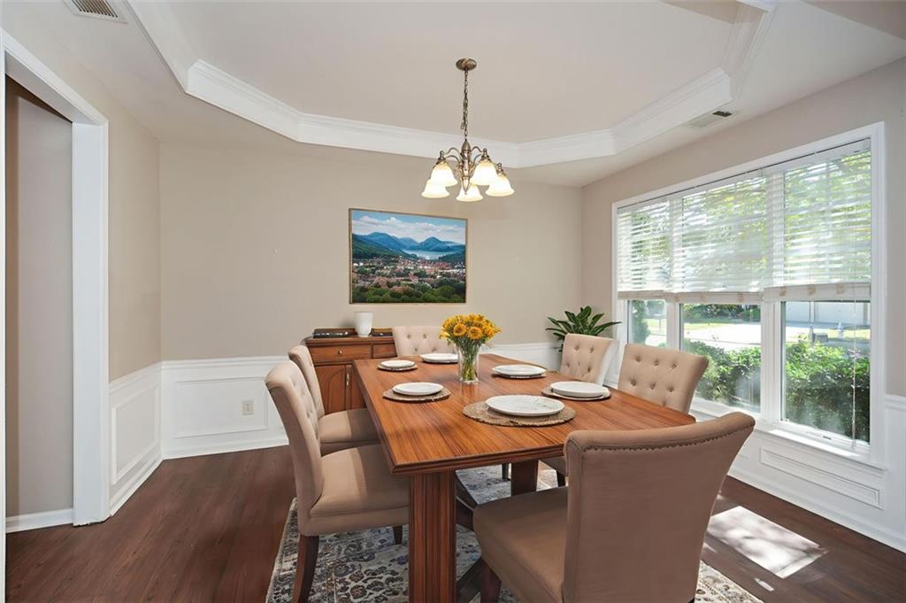 710 Berkeley Terrace Canton, GA 30115 - Photo 7 of 49 a dining room with furniture a window and a chandelier