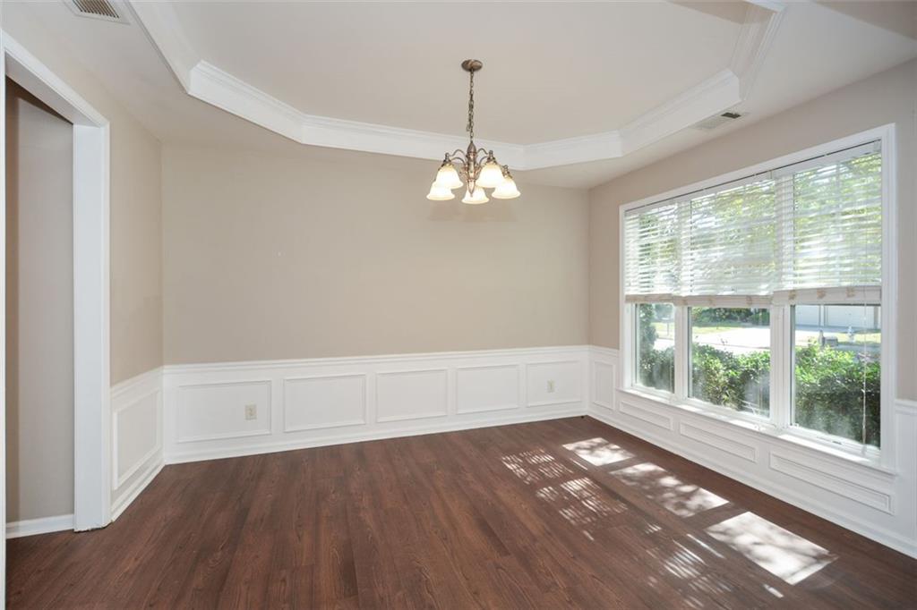 710 Berkeley Terrace Canton, GA 30115 - Photo 9 of 49 a view of a room with wooden floor and windows