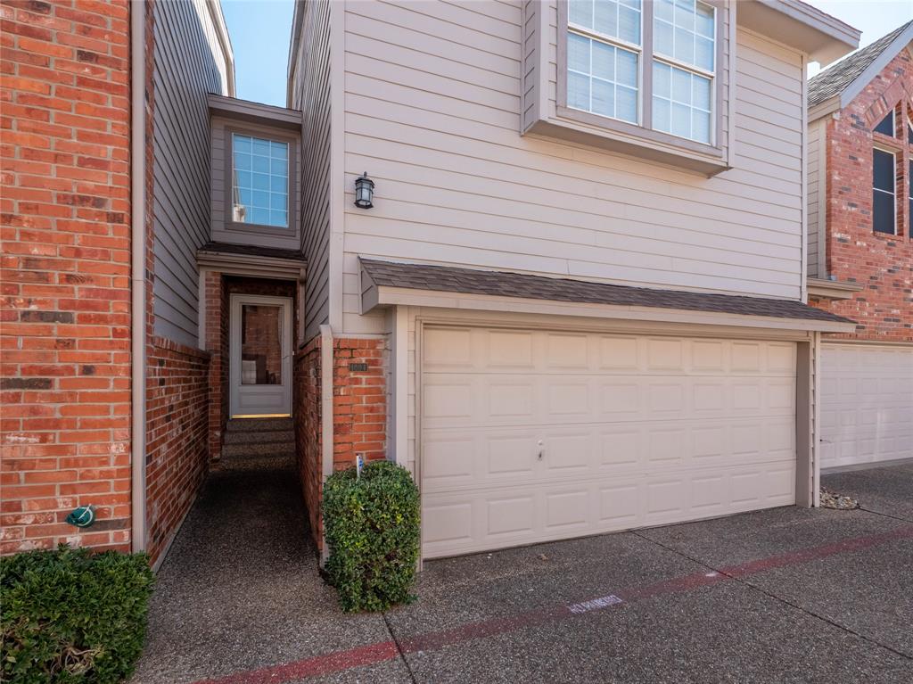 18240 Midway Road, Unit 1004 Dallas, TX 75287 - Photo 1 of 1 a front view of a house with garage