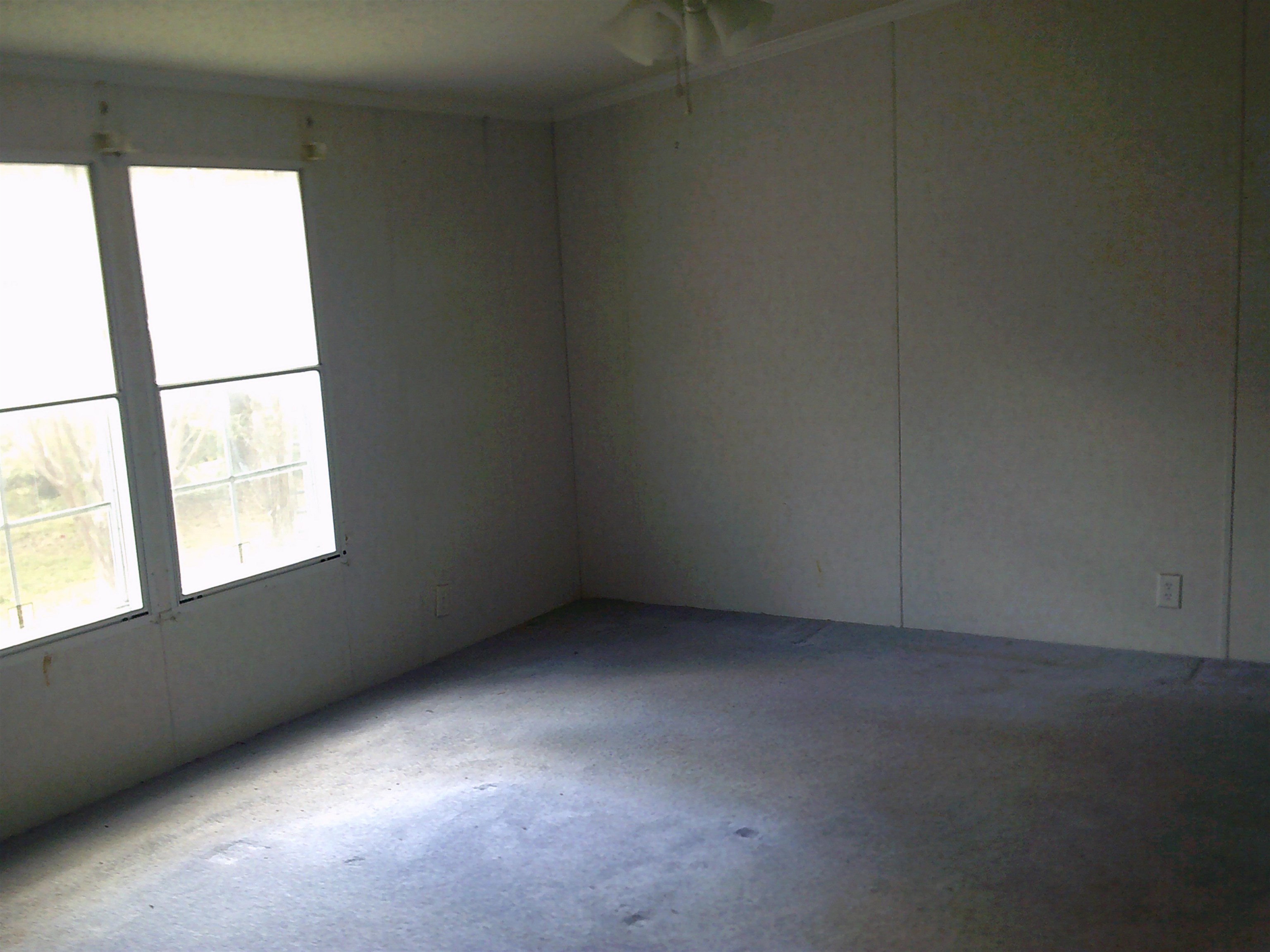 840 Rose Road Somerville, TN 38068 - Photo 4 of 15 Room with light-toned wall paneling and a light-colored ceiling