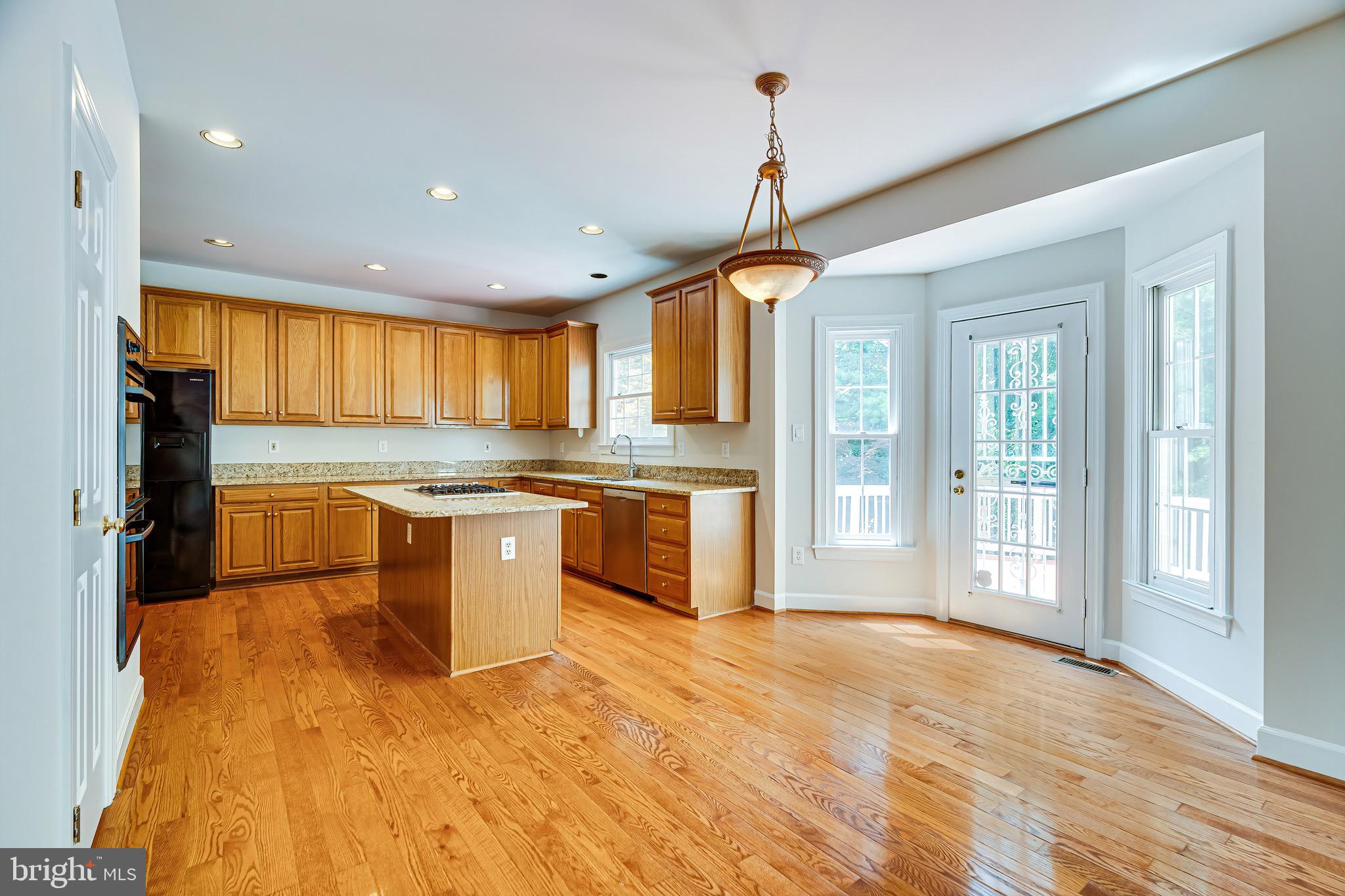 1936 Lord Fairfax Road Vienna, VA 22182 - Photo 20 of 81 a kitchen with stainless steel appliances granite countertop a stove and a sink