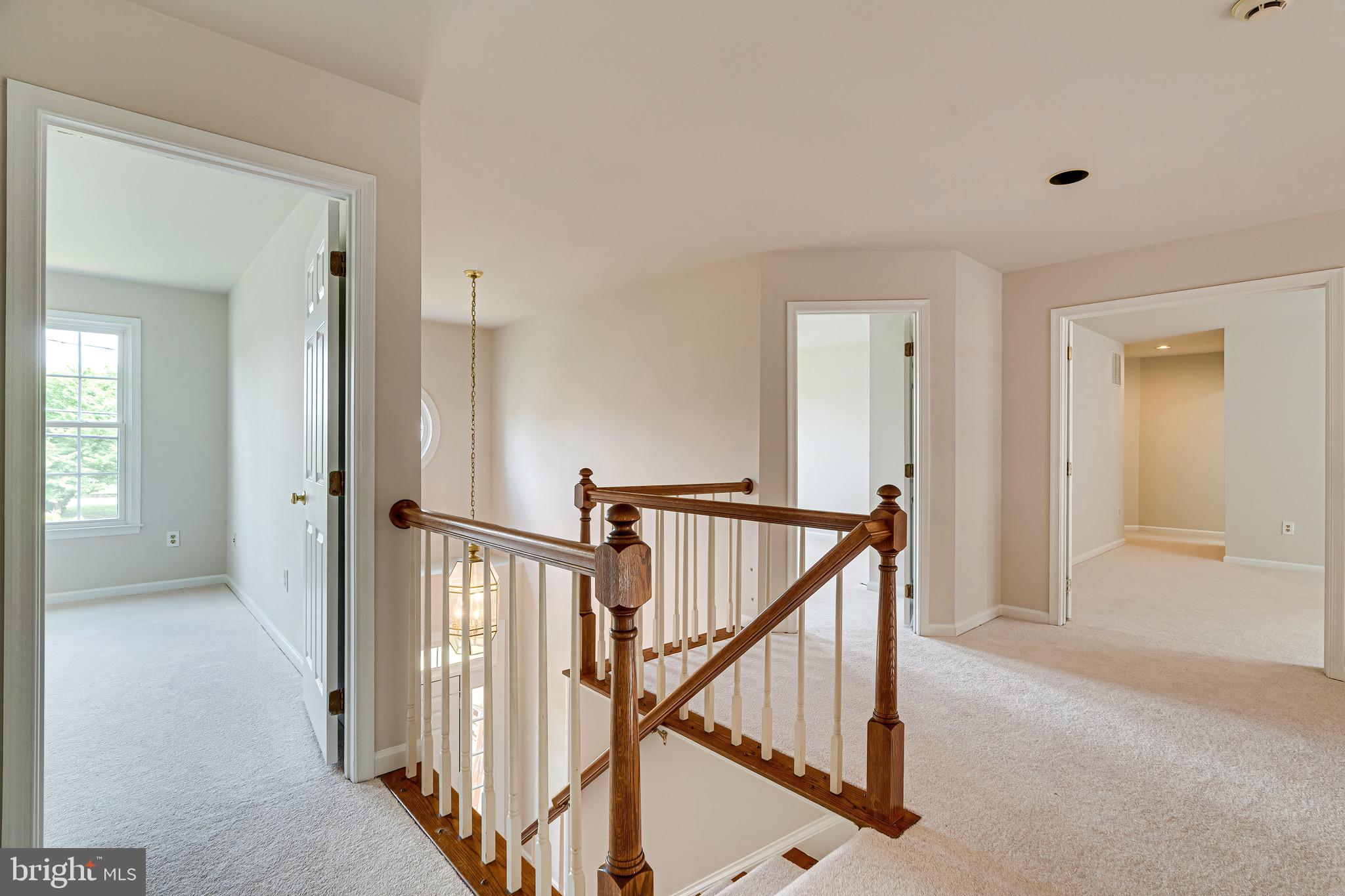 1936 Lord Fairfax Road Vienna, VA 22182 - Photo 35 of 81 a view of a hallway with staircase