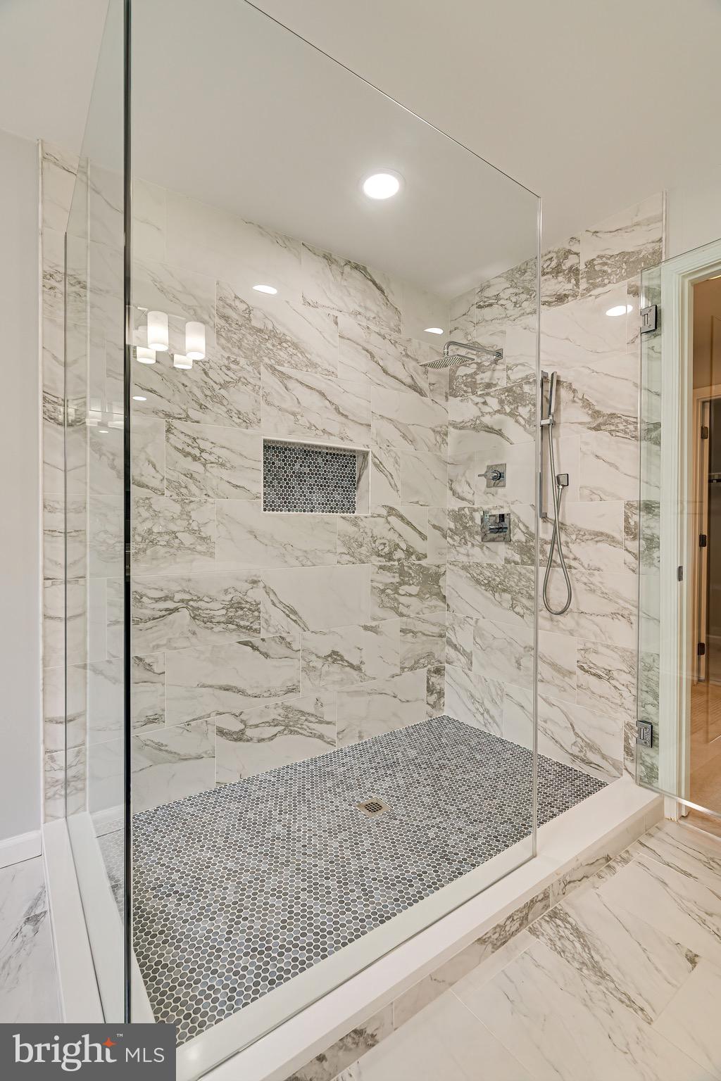 1936 Lord Fairfax Road Vienna, VA 22182 - Photo 45 of 81 a bathroom with a shower and a sink