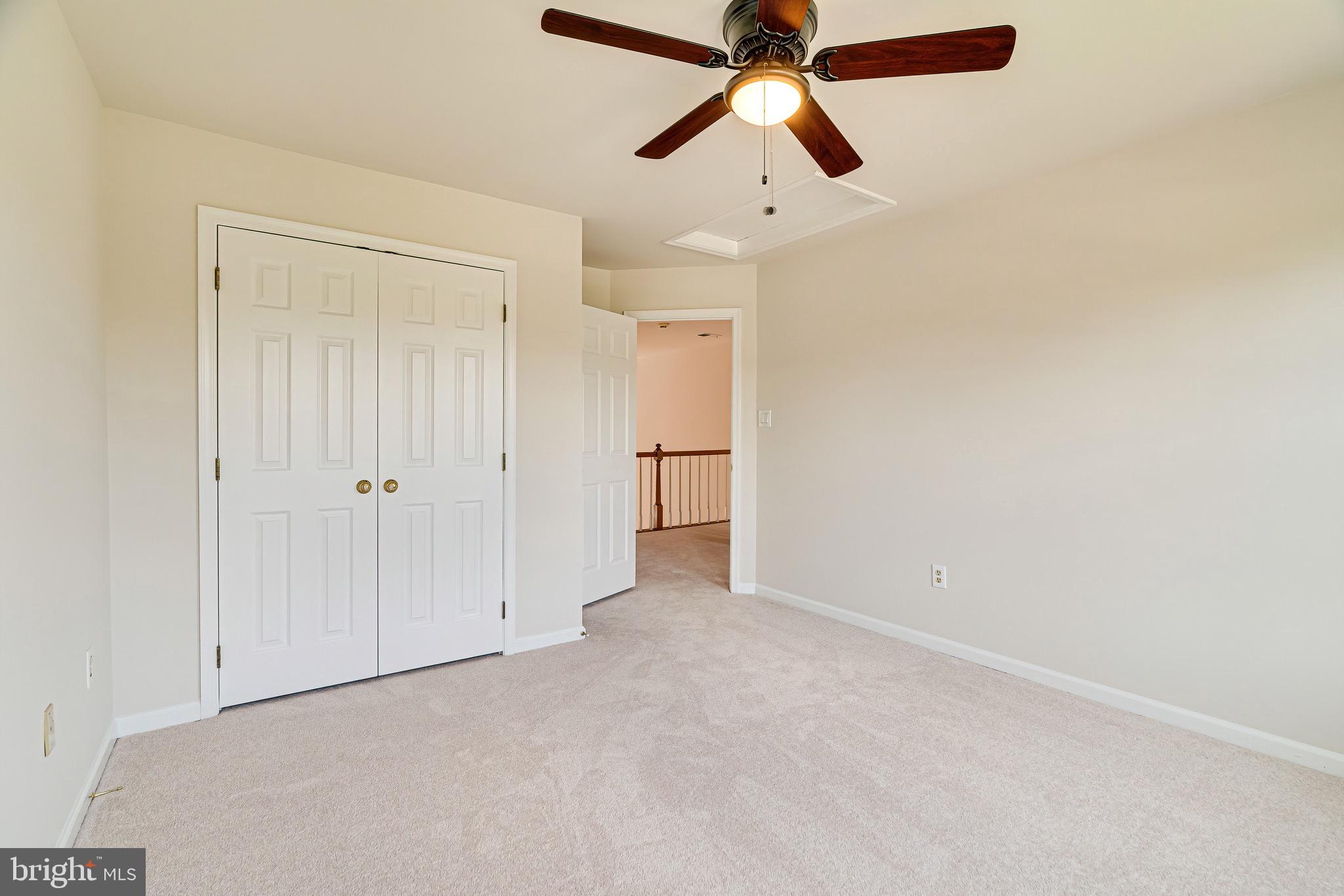 1936 Lord Fairfax Road Vienna, VA 22182 - Photo 49 of 81 an empty room with closet and a chandelier fan