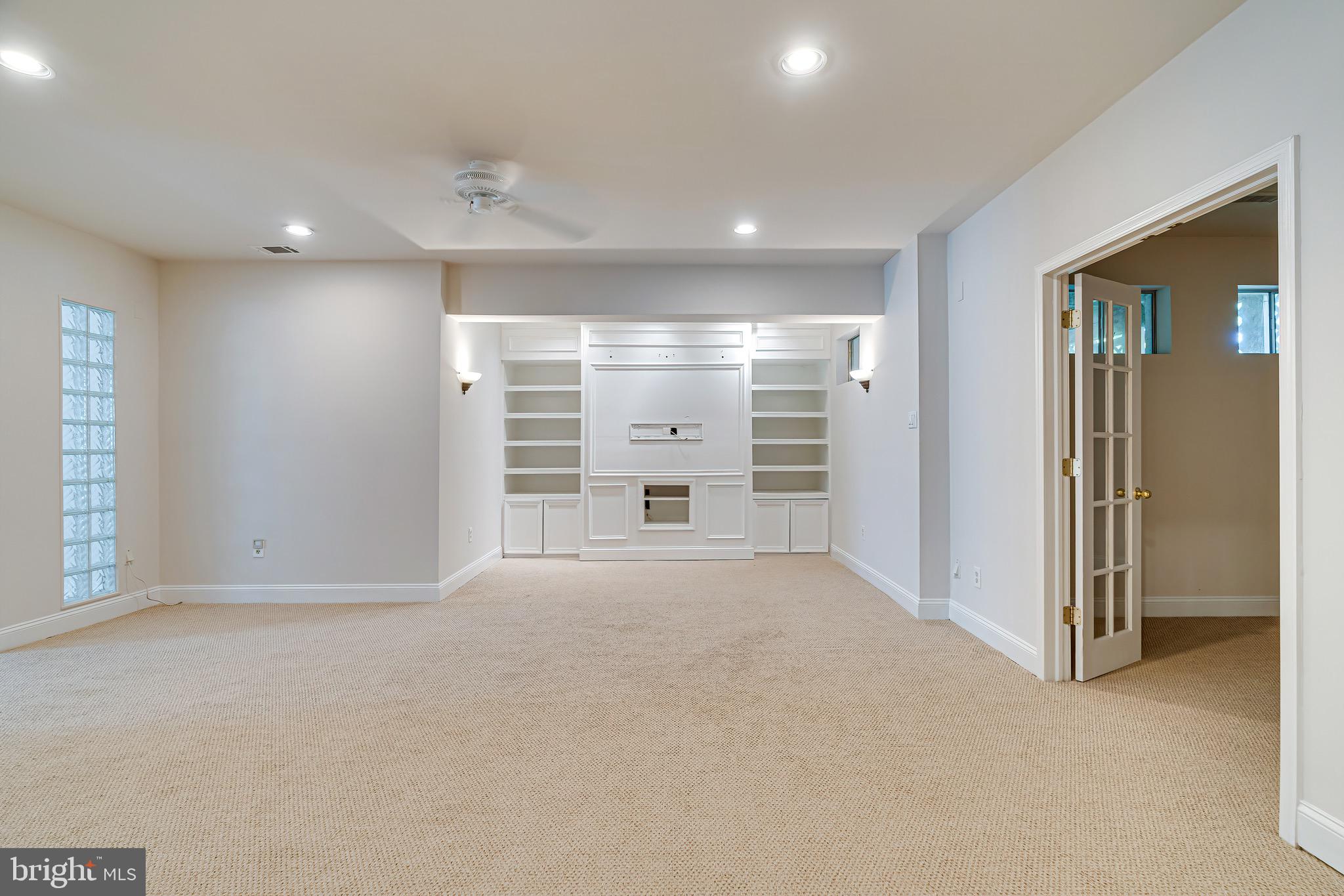 1936 Lord Fairfax Road Vienna, VA 22182 - Photo 56 of 81 a view of an empty room with a fireplace