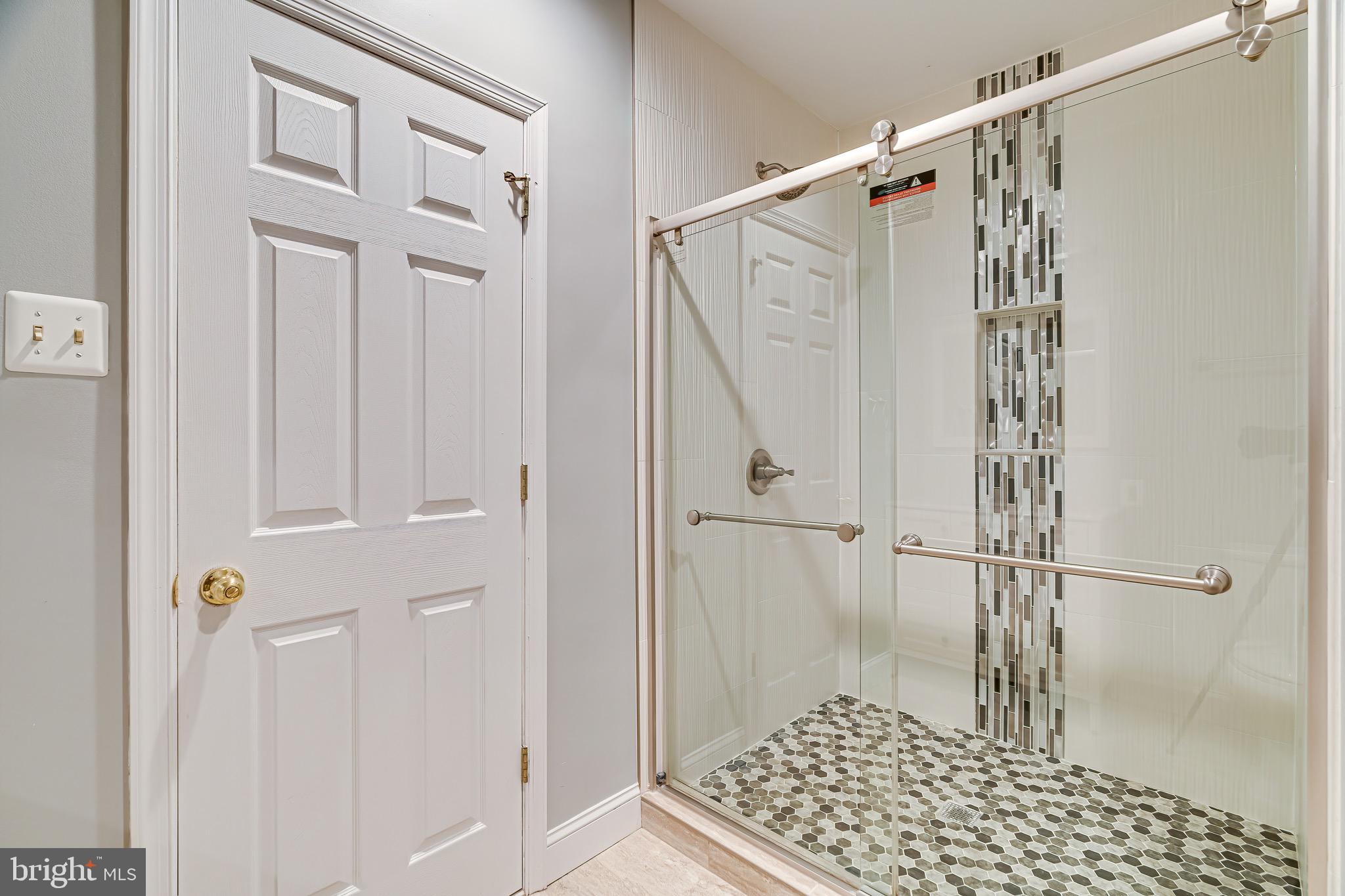 1936 Lord Fairfax Road Vienna, VA 22182 - Photo 65 of 81 a bathroom with a shower