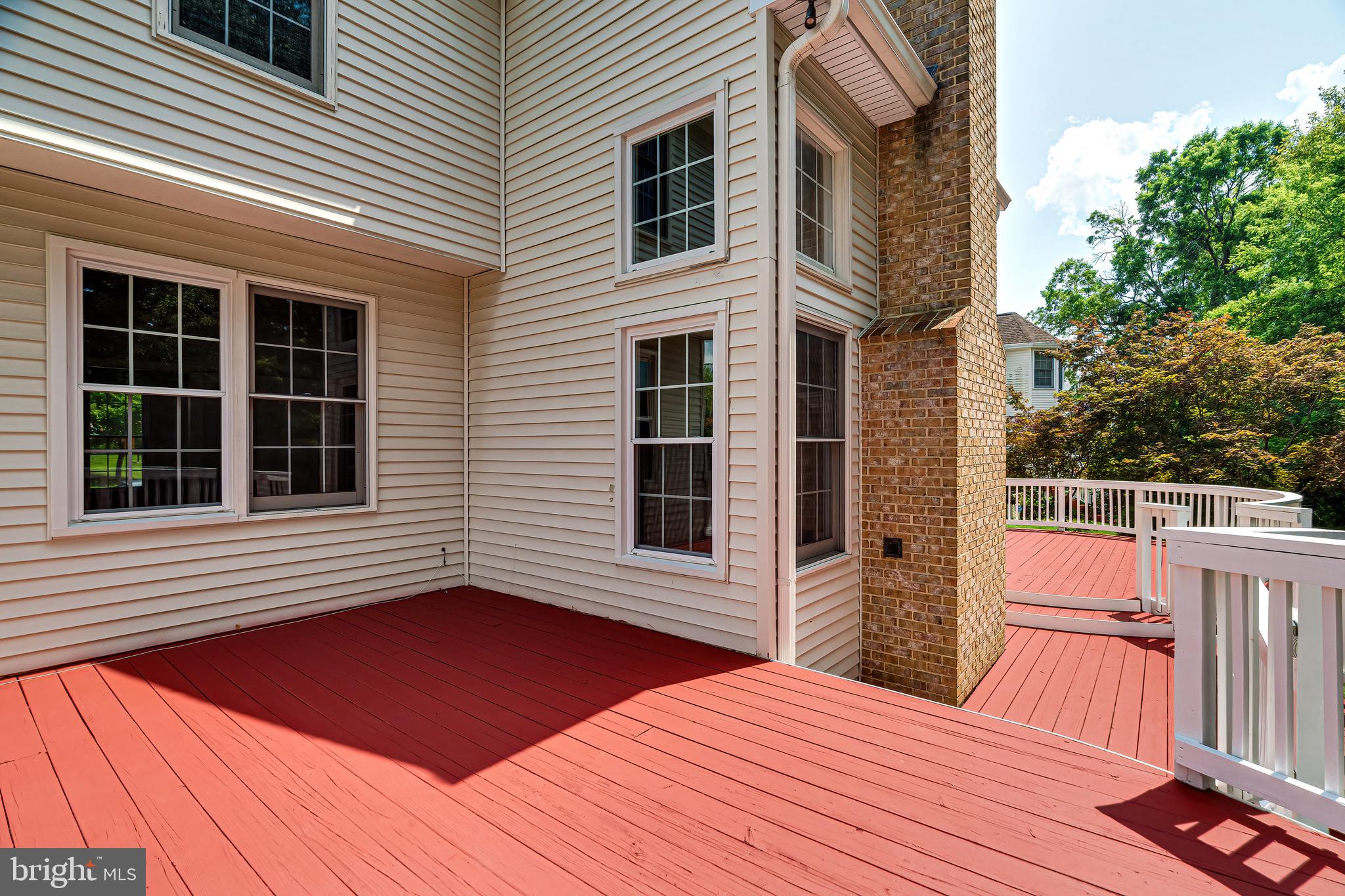 1936 Lord Fairfax Road Vienna, VA 22182 - Photo 69 of 81 a backyard of a house with wooden floor and fence
