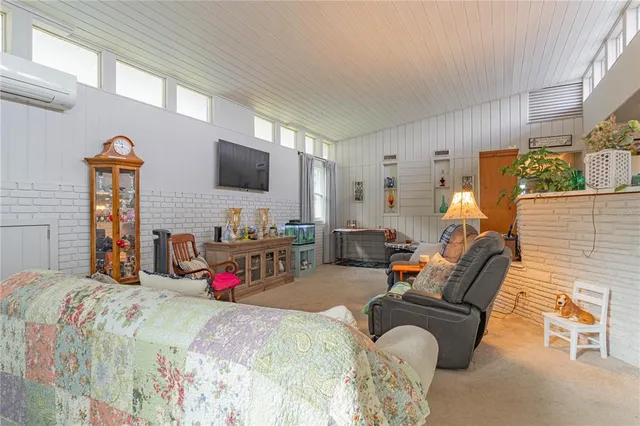 a bathroom with a sink toilet vanity and tub