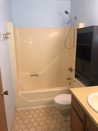 340 Sunderland Road, Unit 36G Worcester, MA 01604 - Photo 15 of 19 a bathroom with a granite countertop bathtub shower sink vanity and toilet