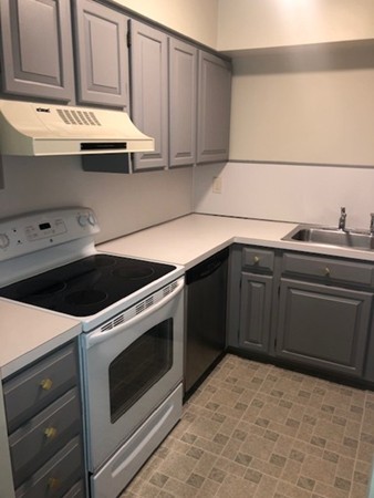 340 Sunderland Road, Unit 36G Worcester, MA 01604 - Photo 3 of 19 a kitchen with granite countertop a sink and a stove