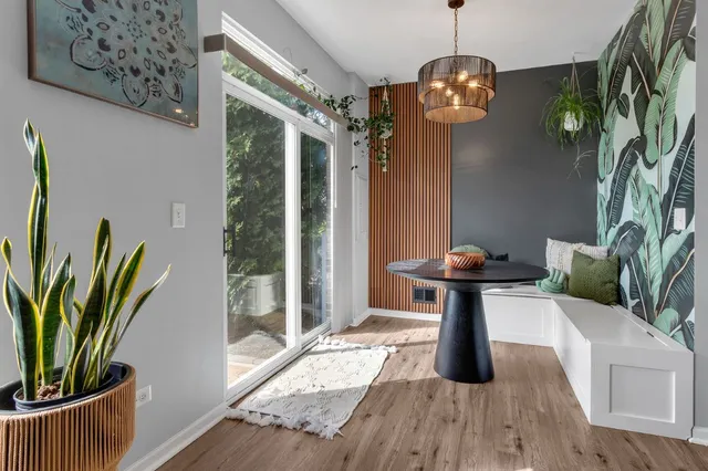 a view of a garden with lawn chairs