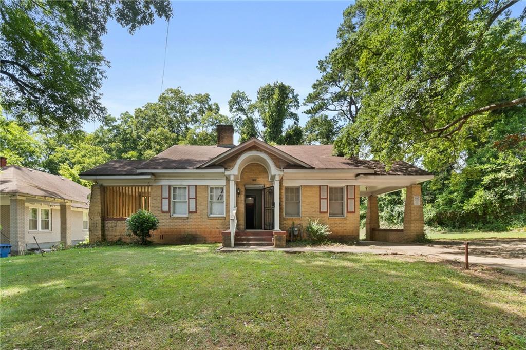 925 Cascade Road Atlanta, GA 30311 - Photo 1 of 1 a front view of house with yard and green space
