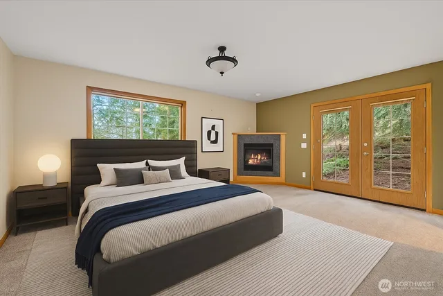 a spacious bathroom with a double vanity sink a mirror and a bathtub