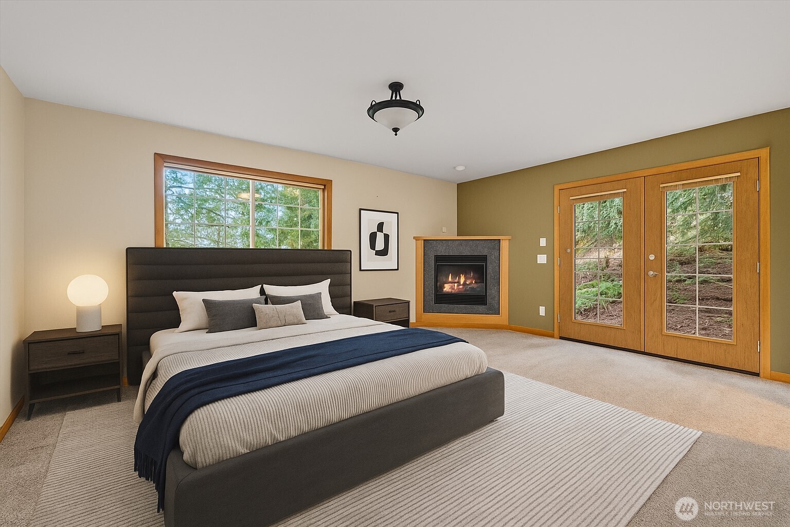 28 Grand View Lane Bellingham, WA 98229 - Photo 14 of 33 a spacious bedroom with a large bed and a fireplace