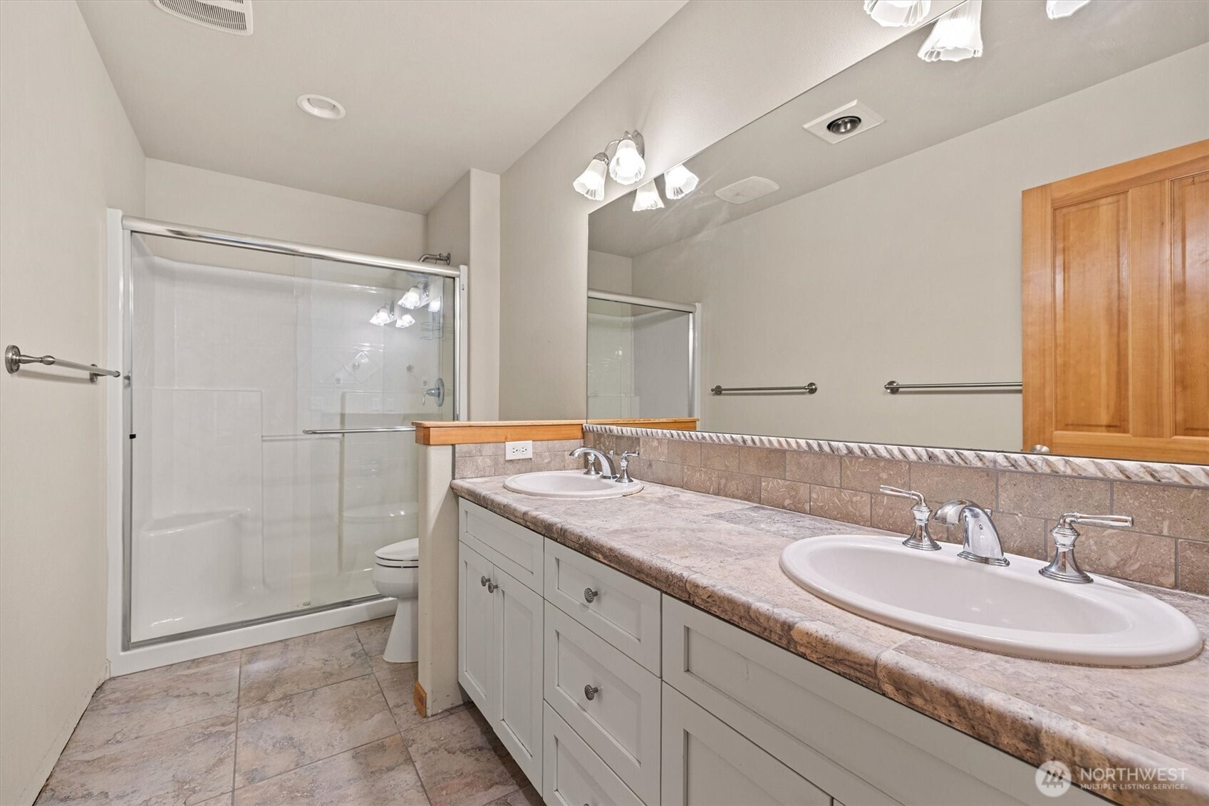 28 Grand View Lane Bellingham, WA 98229 - Photo 24 of 33 a bathroom with a granite countertop sink a mirror and a shower