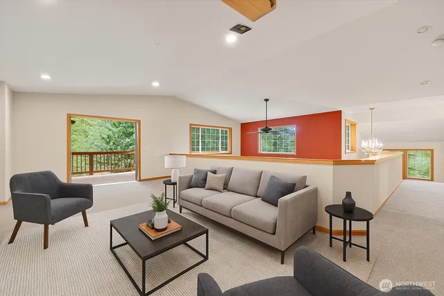 a view of a lush green hillside and houses
