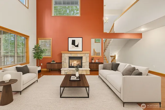 a view of an empty room with window and fireplace