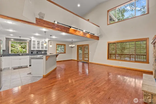 a view of backyard with a deck and wooden floor