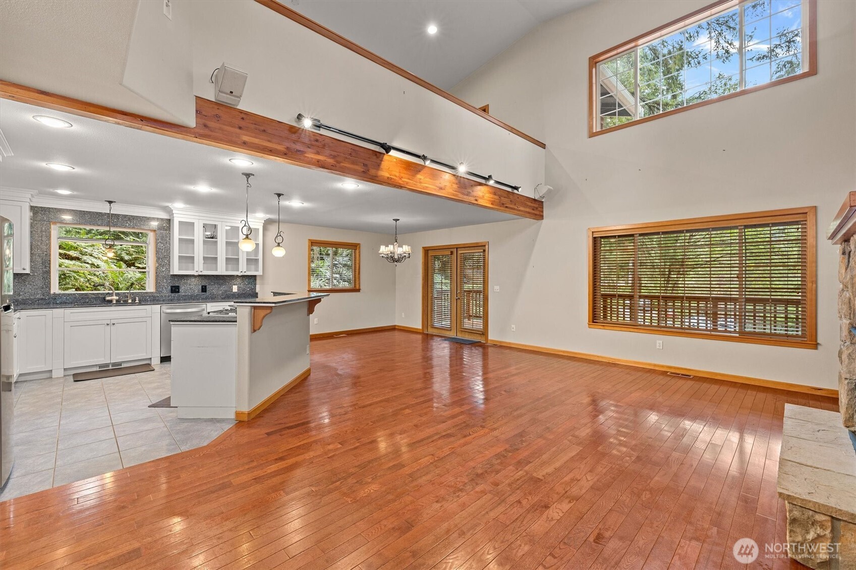 28 Grand View Lane Bellingham, WA 98229 - Photo 7 of 33 a view of an empty room with kitchen view and wooden floor