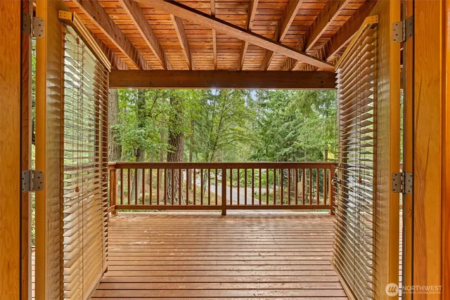 a large kitchen with kitchen island white cabinets and stainless steel appliances