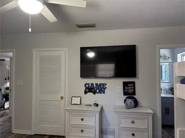 a view of an entryway with cabinets